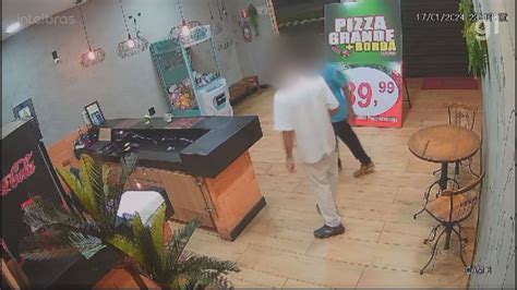 Vídeo Homem tenta assaltar pizzaria mas comerciante reage e agride