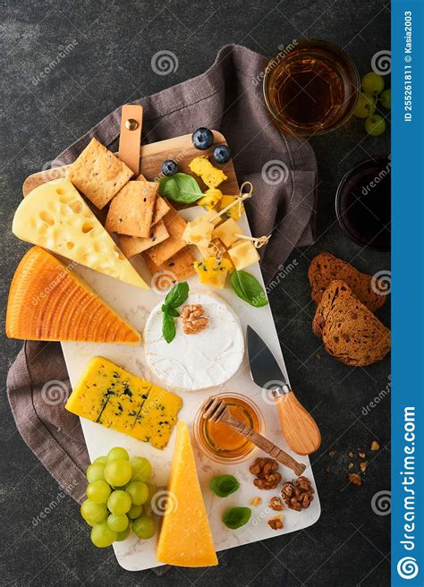 Assortment Of Cheese Honey Cracker Blueberries Grapes With Red And