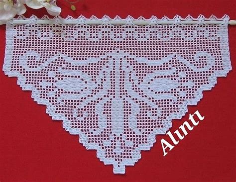 A White Doily On A Red Background With Flowers