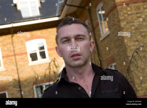 A Portrait Of A Good Looking Homosexual Or Gay Man Leaning Up Against