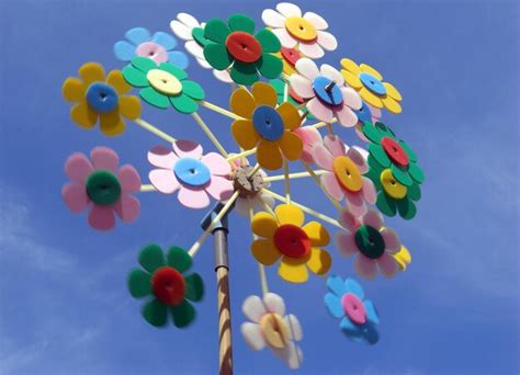 Premium Photo Low Angle View Of Pinwheel Toy Against Blue Sky