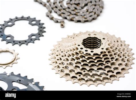 Gears Sprockets And Chain Of A Mountain Sports Bike On A White