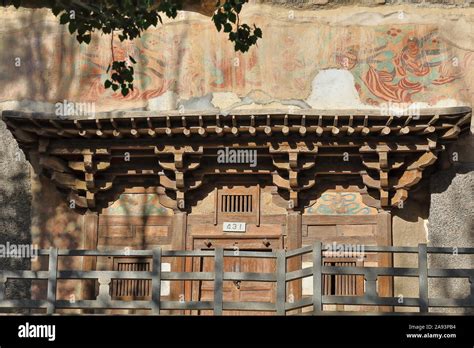 Wooden porch of cave 431-Mogao Buddhist caves. Dunhuang-Gansu province ...