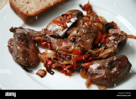 Pan Fried Chicken Livers With Caramelised Onions And Red Peppers Served