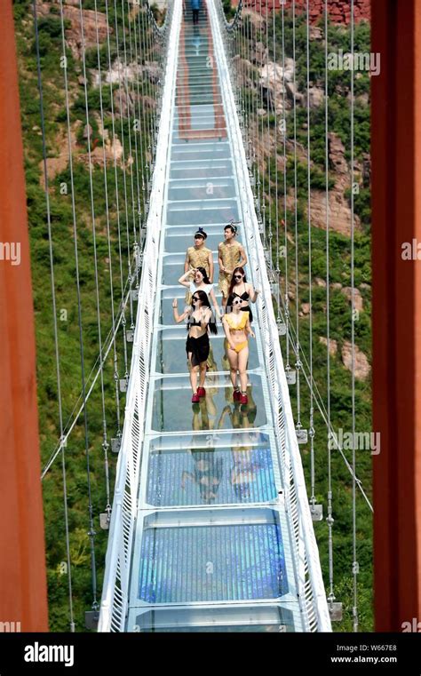 Chinese Beauties In Bikini Pose On The D Glass Bridge At The Wan An