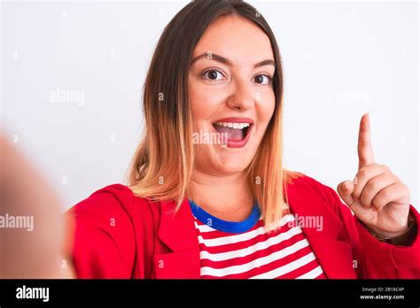 Beautiful Woman Wearing Striped T Shirt And Jacket Standing Over