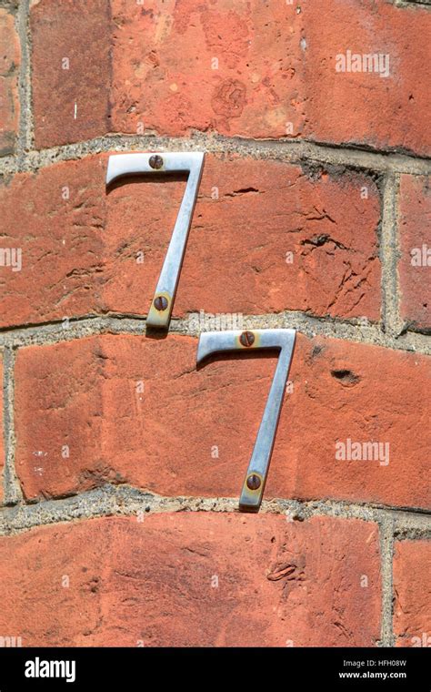 House Number 77 Sign On Wall Stock Photo Alamy