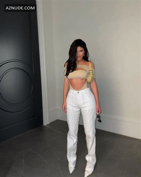 Kylie Jenner Sexy Shows Off Curves In A Strappy Nude Cutout Bodysuit With White Jeans AZNude