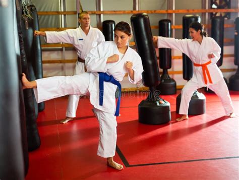 Group of People in Kimono Exercising with Punching Bags Stock Photo - Image of karate, asian ...