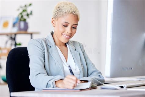 Business Woman Writing And Planning Schedule In Notebook With A Smile At Office Administration