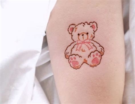 A Small Teddy Bear Tattoo On The Arm