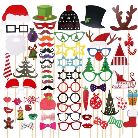 An Assortment Of Christmas Photo Booth Props On Sticks With Santa S