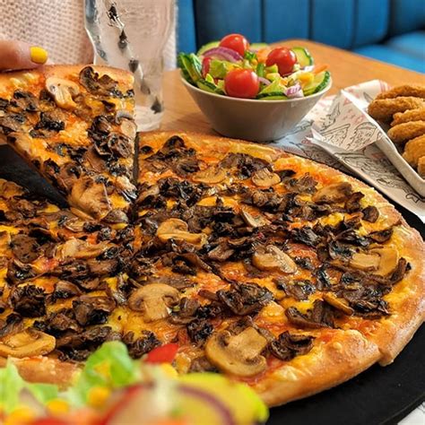 Pizza Hut Adds New Vegan Options To Its Menu