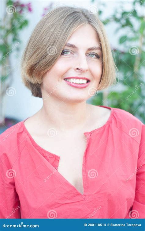 Portrait Of A Beautiful Young Blonde Girl With Green Eyes Young Woman