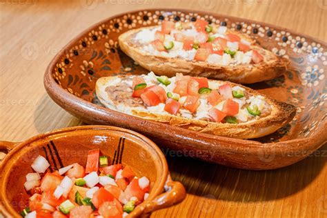 Mexican Molletes Traditional Food With Bread Beans Cheese Tomato