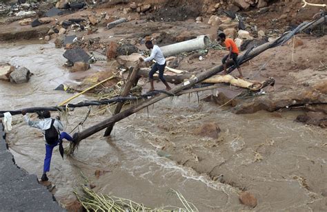 South Africa flooding: Over 300 killed after flooding washed away roads ...