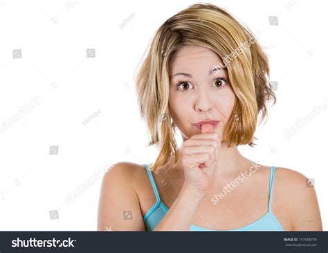 Closeup Portrait Of Woman With Finger In Mouth Sucking Thumb Or Biting