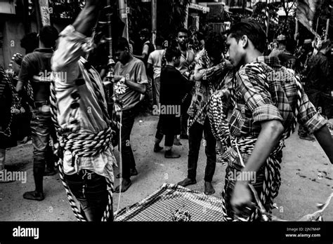 Bangladeshi Shia Muslims March And Carry The Flags And Tazia During A