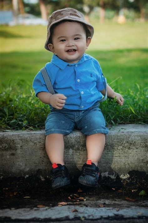 boy wearing blue shirt   park  stock photo