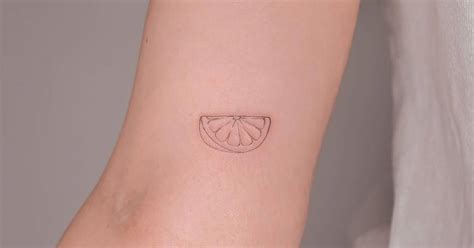 Fine Line Lime Slice Tattoo Placed On The Inner Arm