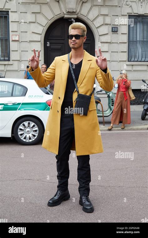 Milan Italy September 25 2021 Ross Butler With Yellow Coat And Black Sunglasses Before