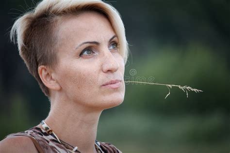 Close Up Of A Woman Blonde Middle Aged Nude Swims In The River Selective Focus Stock Image