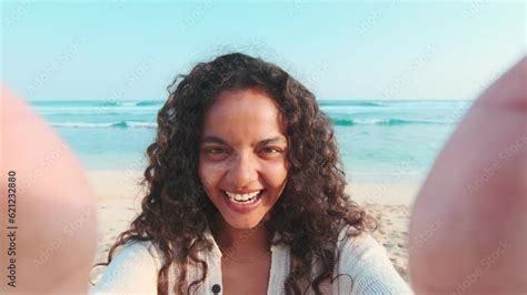 Young Cheerful Attractive Indian Woman Stretches Out Hands With Phone