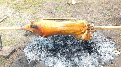 Roasting Pig In Open Pit Lechon Youtube