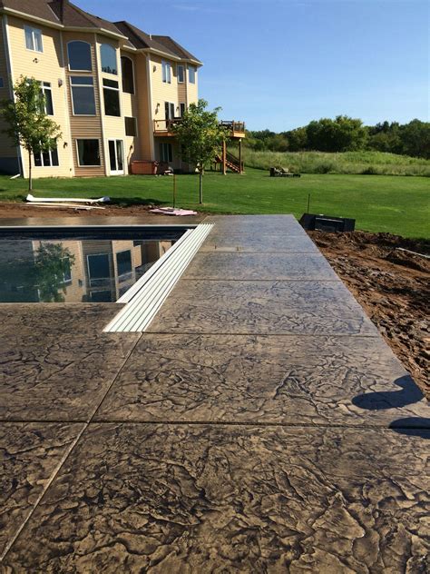 Decorative Concrete Pool Deck With Cantilevered Edge Over Retaining Wall By Sierra Concrete Arts