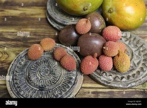 Tropical Fruits Lychees And Passion Fruit Or Maracuya And Mango On Wooden Background Stock