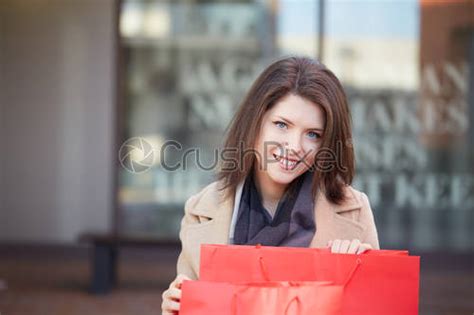 Pretty Woman Walking With Shopping Bag Stock Photo Crushpixel