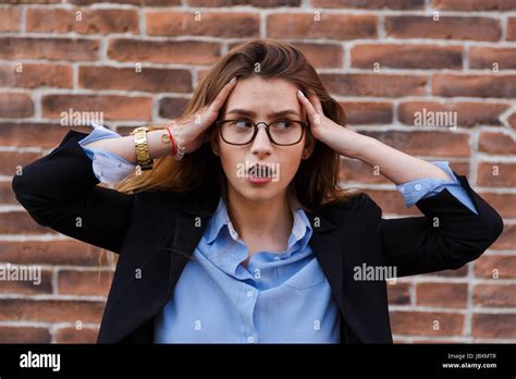 Frustrated Business Woman Holding His Hands To Her Head In Frustration