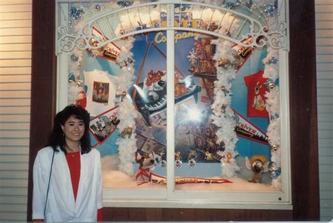Olivia in front of a store window at the Disneyland Hotel | Flickr
