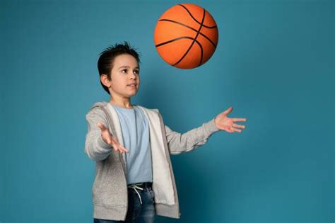 Kids Throwing Ball Stock Photos, Images and Backgrounds for Free Download