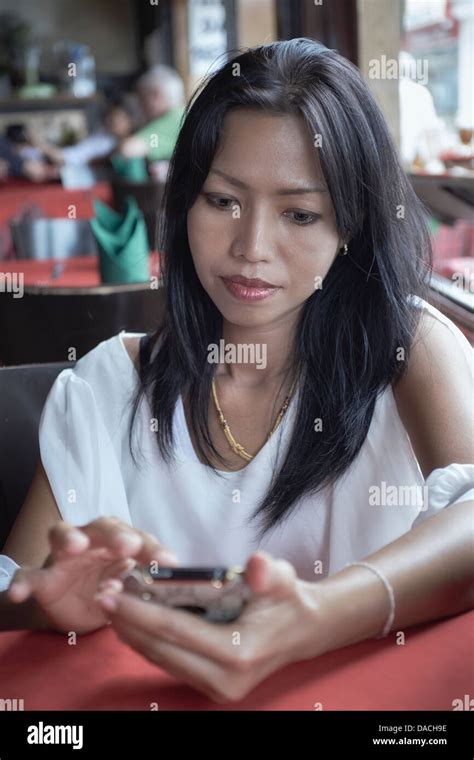 40 Year Asian Woman Using A Mobile Phone Thailand S E Asia Stock