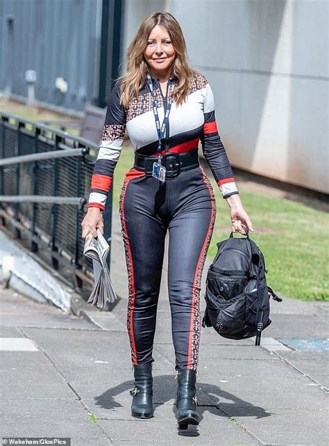 Best 12 Carol Vorderman displays her smooth complexion and eye-popping