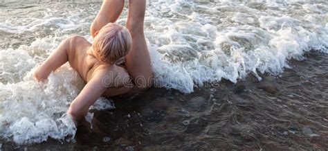 Naked Woman Playfully Lying On The Sea Shore Stock Photo Image Of Coast Figure