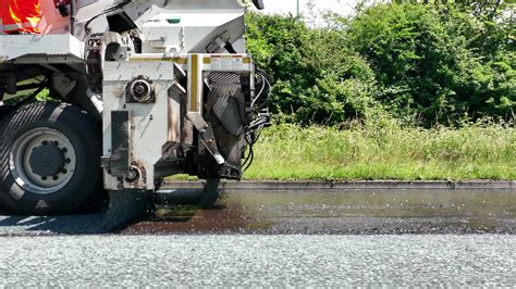 Road Resurfacing By Surface Dressing Process Stock Video At