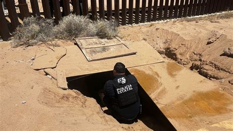 Hallan un narcotúnel bajo el muro fronterizo entre México y EE UU