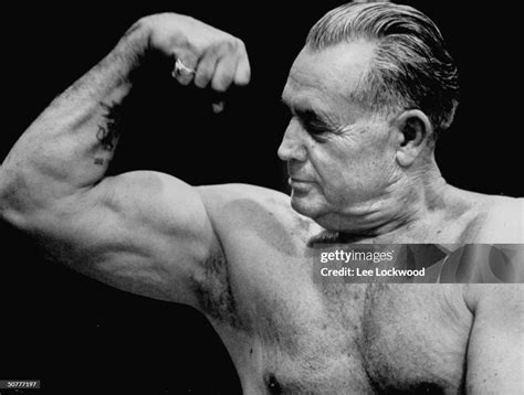 Famous Body Builder Charles Atlas Flexing His Biceps News Photo