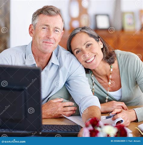 Staying On Top Of Their Income And Expenses Portrait Of A Mature Married Couple Going Through