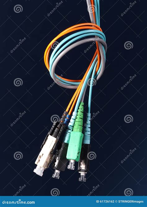 Bundle Of Three Fiber Optic Patch Cords With Connectors Arranged In A