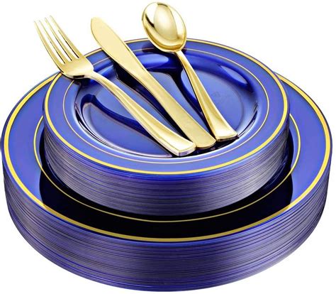 A Blue Plate With Gold Trim And Two Forks