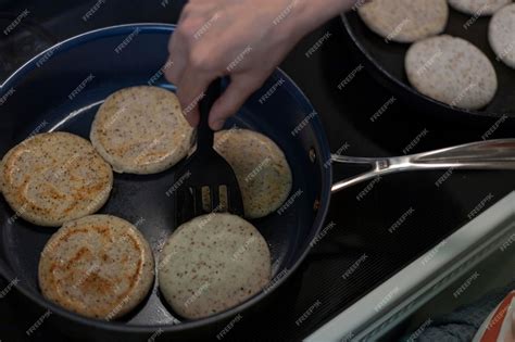 Premium Photo | Arepa in pan prepared by mixing dry precooked corn ...