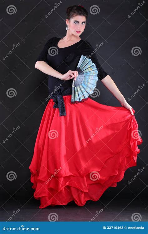 Attractive Spanish Young Woman Dancing Flamenco Over Black Backg Stock