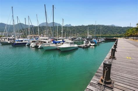 Premium Photo Sailboats Moored On Sea Against Clear Sky