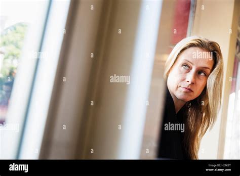 Portrait Of A Blonde Woman Looking Sideways Stock Photo Alamy