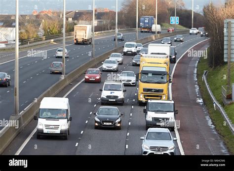 Vehicles Driving Along The M2 Motorway Outside Belfast At Rush Hour