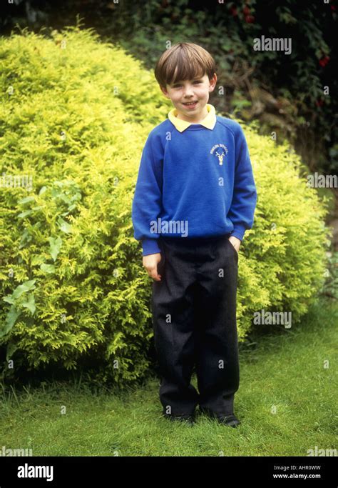 Young boy wearing school uniform looking relaxed, England, UK Stock ...