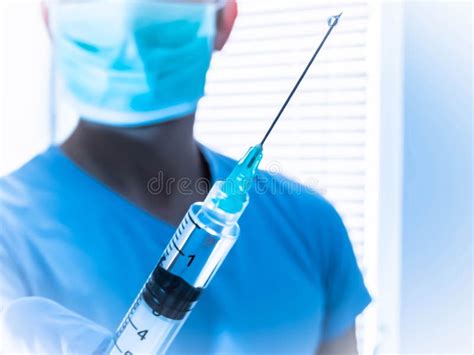 Injection Of Anesthesia Agent In Intravenous Line In Hand Stock Photo